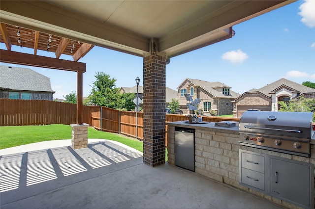 14800 Star Creek Dr, Aledo, TX 76008 - fenced backyard with exterior kitchen, a patio area, and a residential view