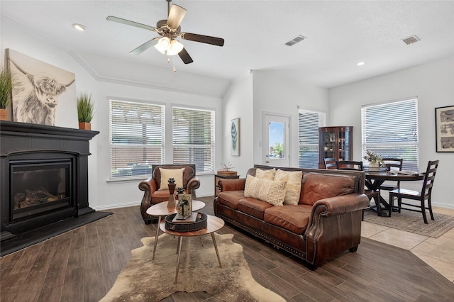 14800 Star Creek Dr, Aledo, TX 76008 - living room with ceiling fan, wood finished floors, a glass covered fireplace, and recessed lighting