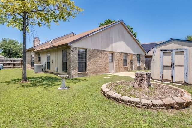 1524 Regent St, Mesquite, TX 75149 - rear view of property with a storage unit and a chimney