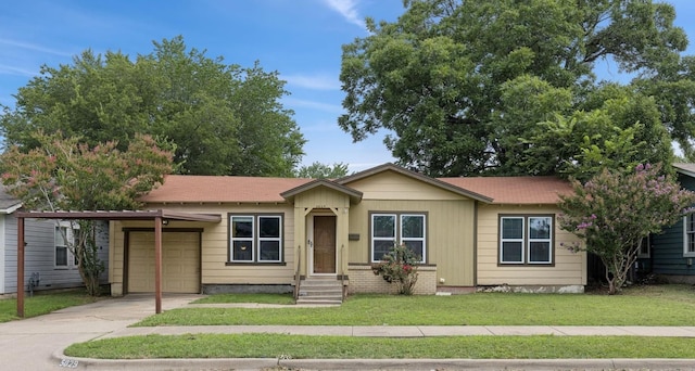 5029 Jerri Ln, Haltom City, TX 76117 - ranch-style house featuring a garage, concrete driveway, and a front yard