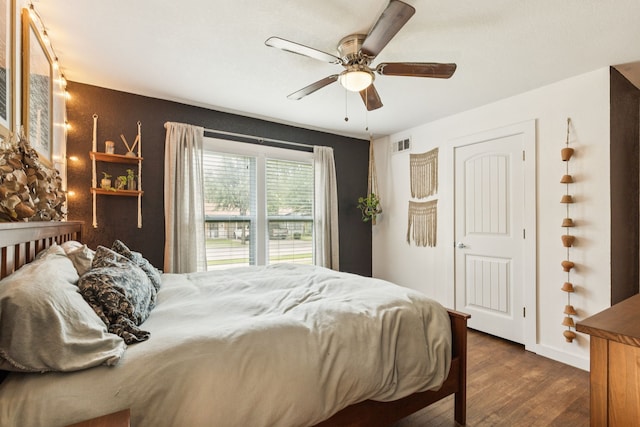 5029 Jerri Ln, Haltom City, TX 76117 - bedroom featuring wood finished floors and a ceiling fan