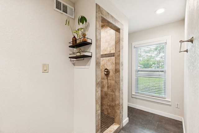 5029 Jerri Ln, Haltom City, TX 76117 - bathroom with tiled shower, tile patterned floors, and recessed lighting