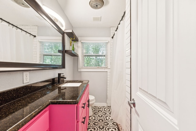 5029 Jerri Ln, Haltom City, TX 76117 - bathroom with vanity, tile patterned floors, and curtained shower
