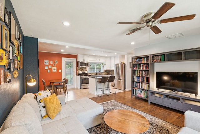 5029 Jerri Ln, Haltom City, TX 76117 - living area with a ceiling fan, recessed lighting, and light wood-type flooring