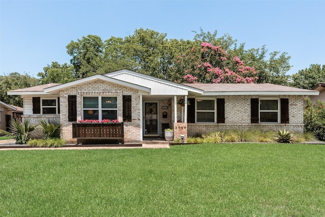 714 Silverstone Dr, Richardson, TX 75080 - view of front of home with brick siding and a front lawn