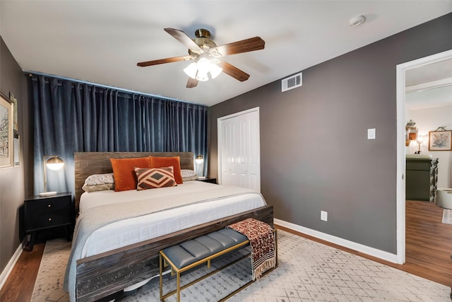 714 Silverstone Dr, Richardson, TX 75080 - bedroom with wood finished floors, a closet, and ceiling fan