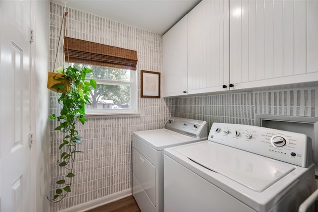 714 Silverstone Dr, Richardson, TX 75080 - laundry area with washing machine and clothes dryer, tile walls, cabinet space, and dark wood-style floors