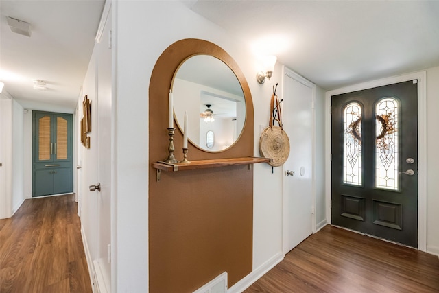 714 Silverstone Dr, Richardson, TX 75080 - entrance foyer with wood finished floors, ceiling fan, and arched walkways