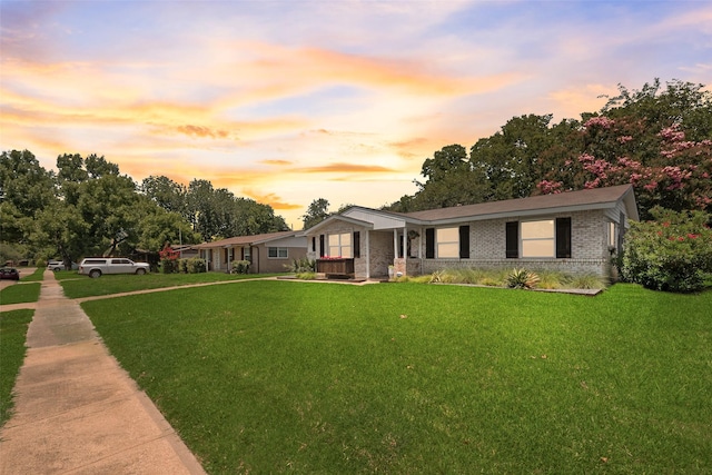 714 Silverstone Dr, Richardson, TX 75080 - ranch-style home featuring a lawn, brick siding, and a porch