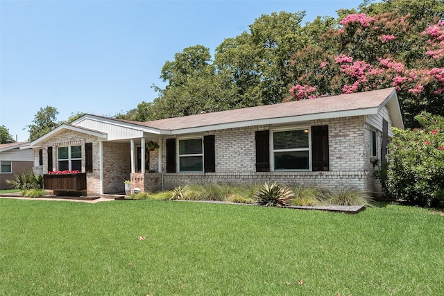 714 Silverstone Dr, Richardson, TX 75080 - ranch-style house featuring brick siding, a front yard, and a porch