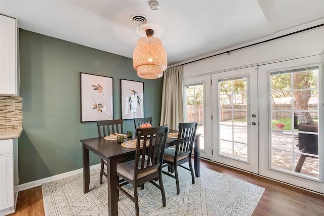 714 Silverstone Dr, Richardson, TX 75080 - dining room with healthy amount of natural light, french doors, and light wood-type flooring