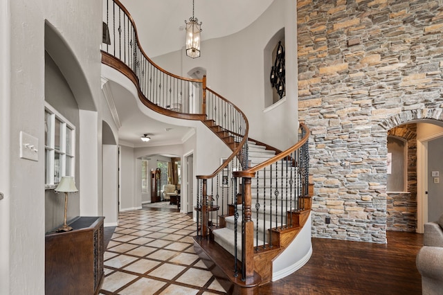 1829 Lewis Crossing Dr, Keller, TX 76248 - entryway featuring ornamental molding, arched walkways, stairs, and a high ceiling