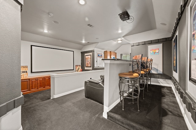 1829 Lewis Crossing Dr, Keller, TX 76248 - cinema room featuring vaulted ceiling, a bar, dark colored carpet, and recessed lighting