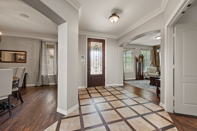 1829 Lewis Crossing Dr, Keller, TX 76248 - entrance foyer with arched walkways, wood finished floors, inlaid floor details, and crown molding