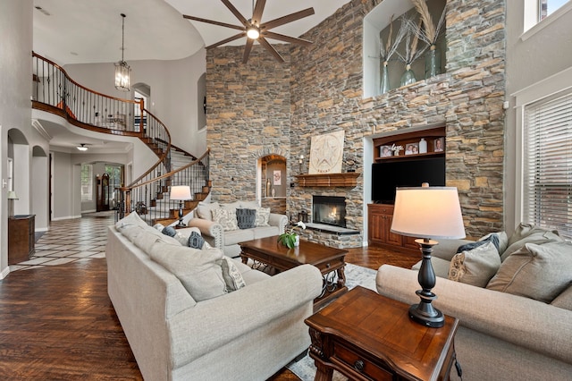 1829 Lewis Crossing Dr, Keller, TX 76248 - living area featuring a high ceiling, arched walkways, a ceiling fan, stairs, and plenty of natural light