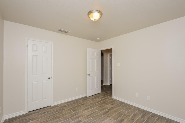 3153 Evangeline Rd, Fort Worth, TX 76140 - unfurnished bedroom with wood finished floors and baseboards