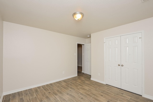 3153 Evangeline Rd, Fort Worth, TX 76140 - unfurnished bedroom with wood finished floors and a closet