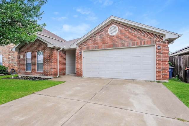 3153 Evangeline Rd, Fort Worth, TX 76140 - single story home with brick siding, concrete driveway, and a garage