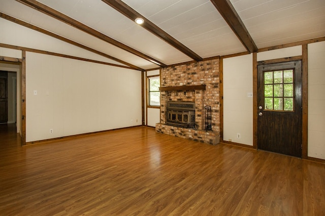3001 Jennifer Ave, Denison, TX 75020 - unfurnished living room featuring wood finished floors and a brick fireplace