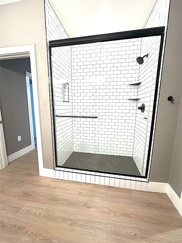 3517 Windhaven Pkwy Unit 1209, Lewisville, TX 75056 - full bathroom featuring a shower stall and wood finished floors