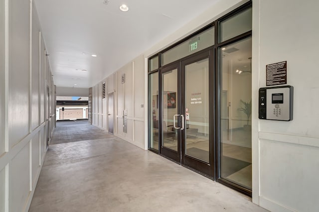 3517 Windhaven Pkwy Unit 1209, Lewisville, TX 75056 - corridor featuring concrete floors and a decorative wall