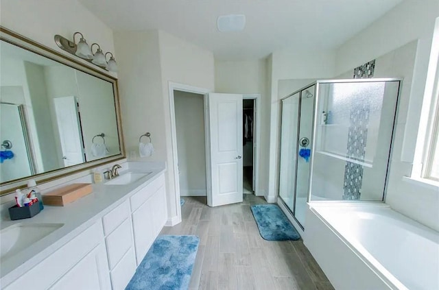 1844 Rio Costilla Rd, Fort Worth, TX 76131 - full bathroom with a shower stall, double vanity, a garden tub, and wood finished floors