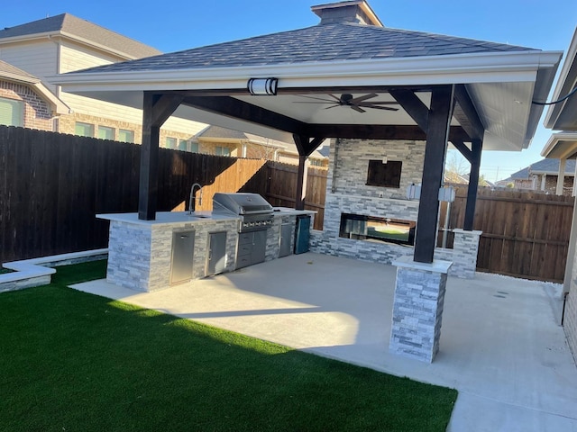 1844 Rio Costilla Rd, Fort Worth, TX 76131 - fenced backyard featuring an outdoor stone fireplace, a gazebo, exterior kitchen, and a patio
