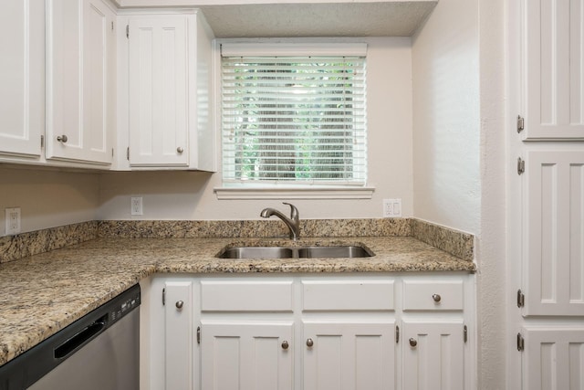 5903 Cameron Dr, Arlington, TX 76017 - kitchen with stainless steel dishwasher, white cabinetry, and light stone counters