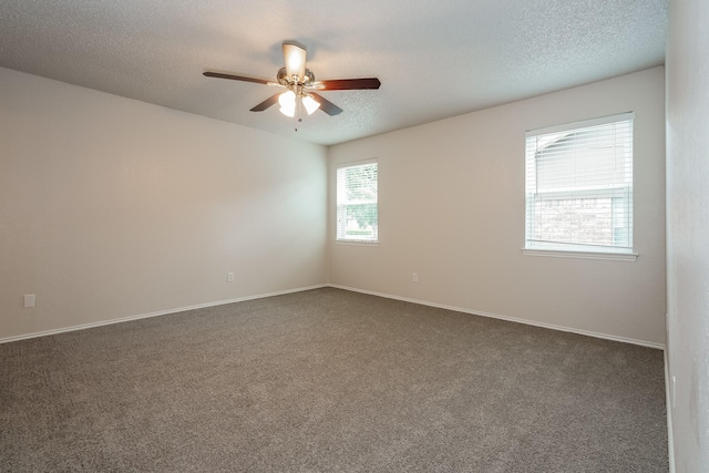 5903 Cameron Dr, Arlington, TX 76017 - unfurnished room with dark colored carpet, a ceiling fan, and a textured ceiling