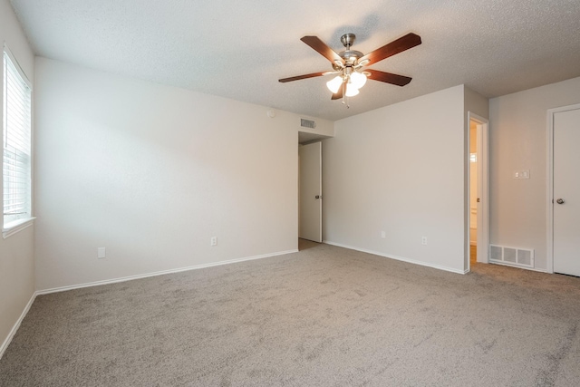 5903 Cameron Dr, Arlington, TX 76017 - carpeted empty room featuring a ceiling fan and a textured ceiling