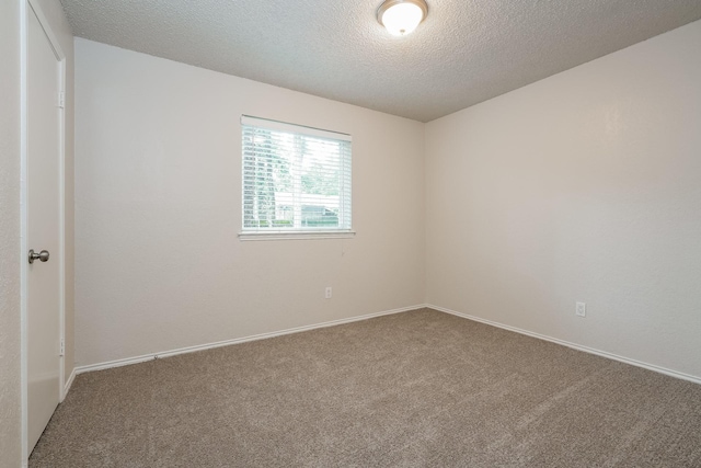5903 Cameron Dr, Arlington, TX 76017 - carpeted empty room with a textured ceiling and baseboards