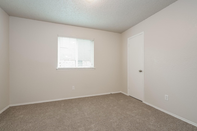 5903 Cameron Dr, Arlington, TX 76017 - carpeted empty room featuring a textured ceiling and baseboards