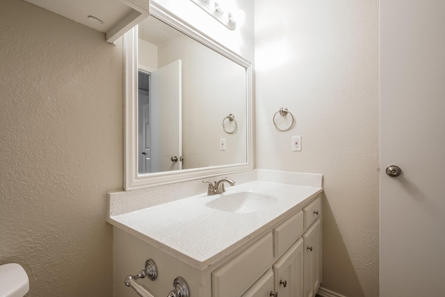 5903 Cameron Dr, Arlington, TX 76017 - half bath with vanity and a textured wall