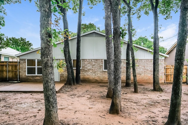 5903 Cameron Dr, Arlington, TX 76017 - view of home's exterior with brick siding and a patio