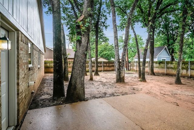 5903 Cameron Dr, Arlington, TX 76017 - fenced backyard with a patio area
