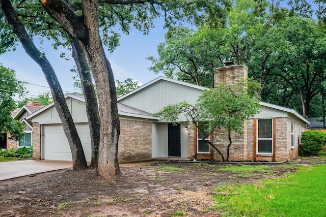5903 Cameron Dr, Arlington, TX 76017 - mid-century home with brick siding, an attached garage, driveway, and a chimney