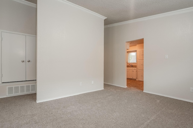 5903 Cameron Dr, Arlington, TX 76017 - carpeted empty room with ornamental molding and a textured ceiling
