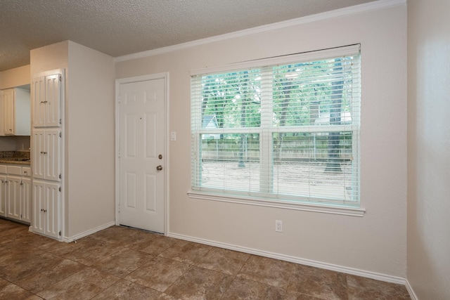 5903 Cameron Dr, Arlington, TX 76017 - foyer featuring crown molding and a textured ceiling