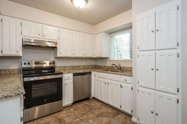 5903 Cameron Dr, Arlington, TX 76017 - kitchen featuring appliances with stainless steel finishes, under cabinet range hood, white cabinetry, a textured ceiling, and light stone countertops
