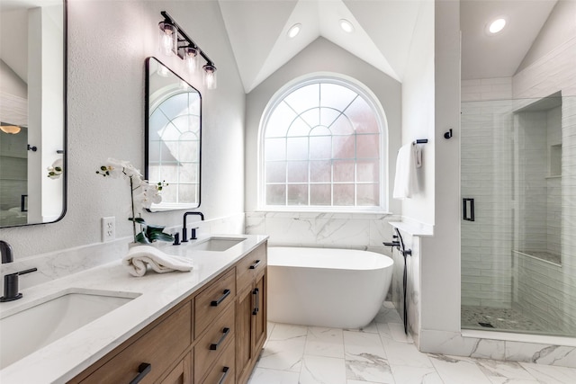 8600 Digby Dr, Plano, TX 75025 - full bathroom featuring a freestanding bath, a shower stall, vaulted ceiling, double vanity, and marble finish flooring