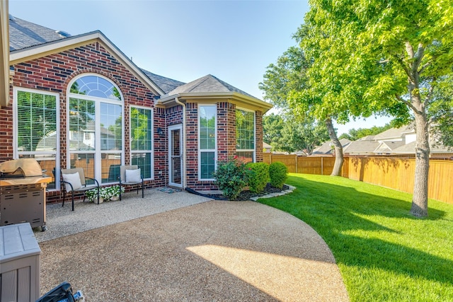 8600 Digby Dr, Plano, TX 75025 - fenced backyard with a patio area and grilling area