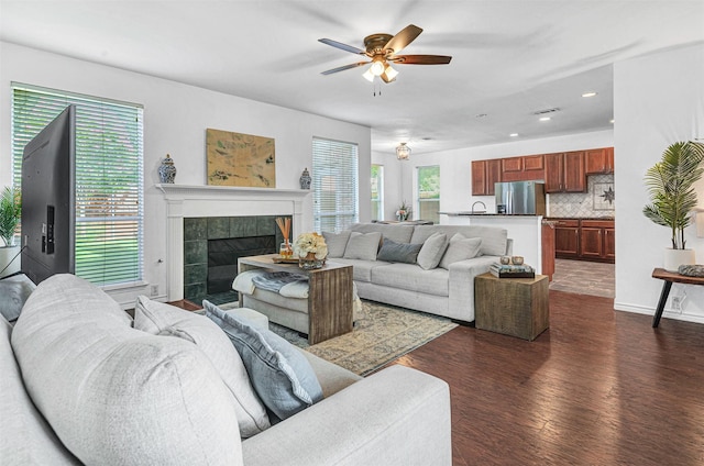2904 Champlin Ct, Richardson, TX 75082 - living room with healthy amount of natural light, dark wood finished floors, ceiling fan, a tile fireplace, and recessed lighting