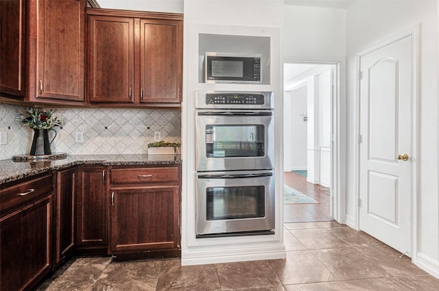 2904 Champlin Ct, Richardson, TX 75082 - kitchen with stainless steel appliances, backsplash, and dark stone countertops