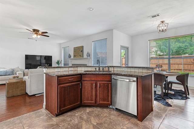 2904 Champlin Ct, Richardson, TX 75082 - kitchen with dishwasher, a ceiling fan, dark stone countertops, a center island with sink, and open floor plan