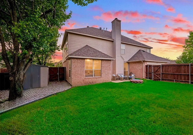 2904 Champlin Ct, Richardson, TX 75082 - back of property with a fenced backyard, brick siding, a storage shed, a chimney, and a patio area