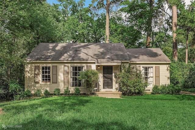 3933 Baltimore Ave, Shreveport, LA 71106 - view of front of home featuring a front lawn and a shingled roof