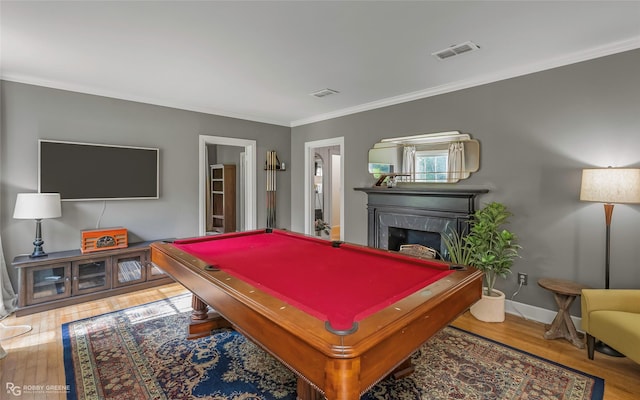 3933 Baltimore Ave, Shreveport, LA 71106 - recreation room featuring ornamental molding, wood finished floors, billiards, and a high end fireplace
