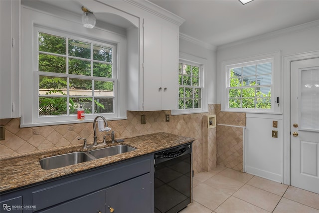 3933 Baltimore Ave, Shreveport, LA 71106 - kitchen featuring dishwasher, light tile patterned floors, dark stone countertops, white cabinets, and tile walls