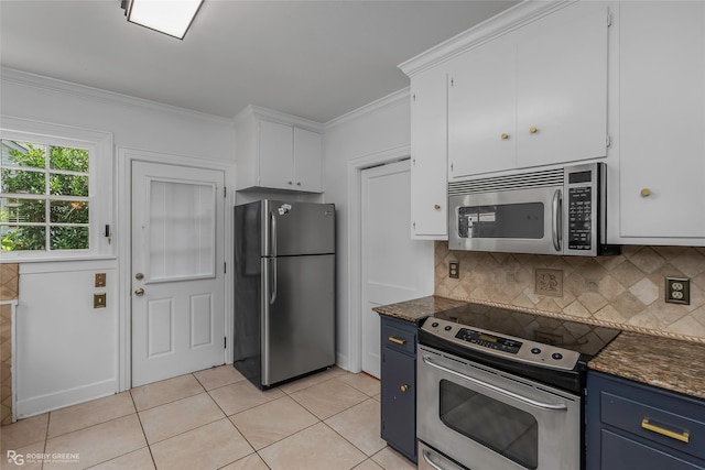 3933 Baltimore Ave, Shreveport, LA 71106 - kitchen with appliances with stainless steel finishes, blue cabinets, white cabinetry, tasteful backsplash, and ornamental molding