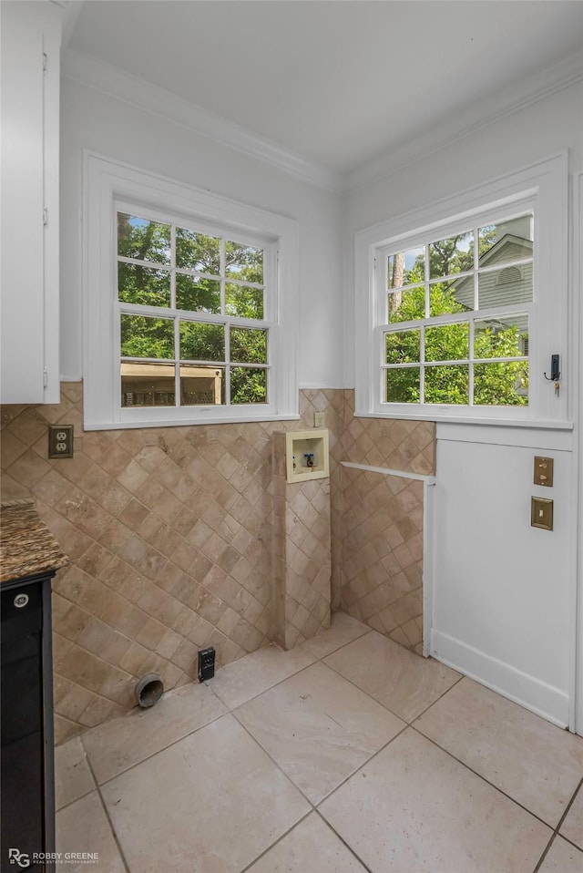3933 Baltimore Ave, Shreveport, LA 71106 - bathroom featuring ornamental molding, tile walls, vanity, tile patterned flooring, and wainscoting